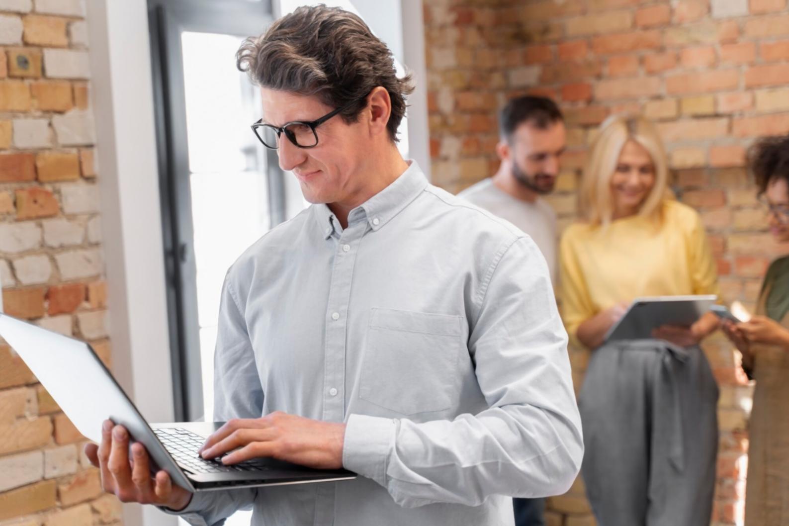 Business owner reviewing financial documents with calculator